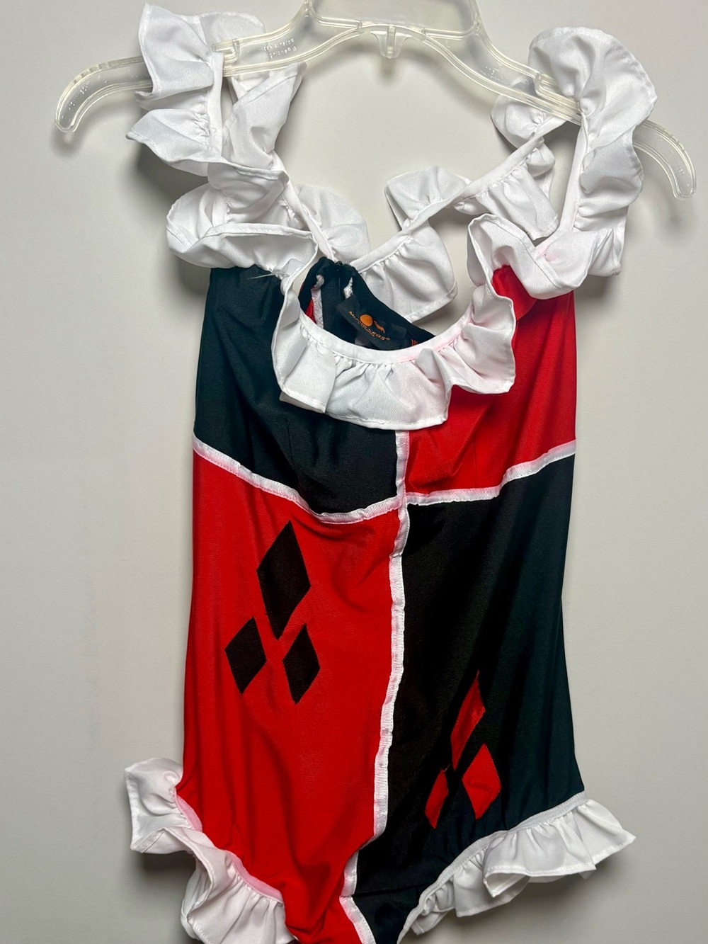 Music Legs Red, Black & White Ruffle Superhero One-Piece